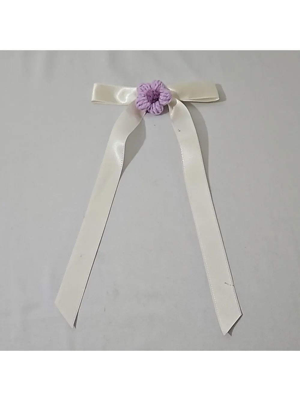 Hand Crafted Ivory Bow with Purple Crochet Flower